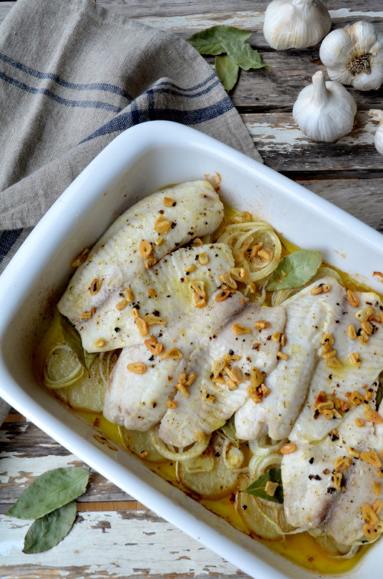 Oven baked tilapia over potatoes and onions, Mama ía